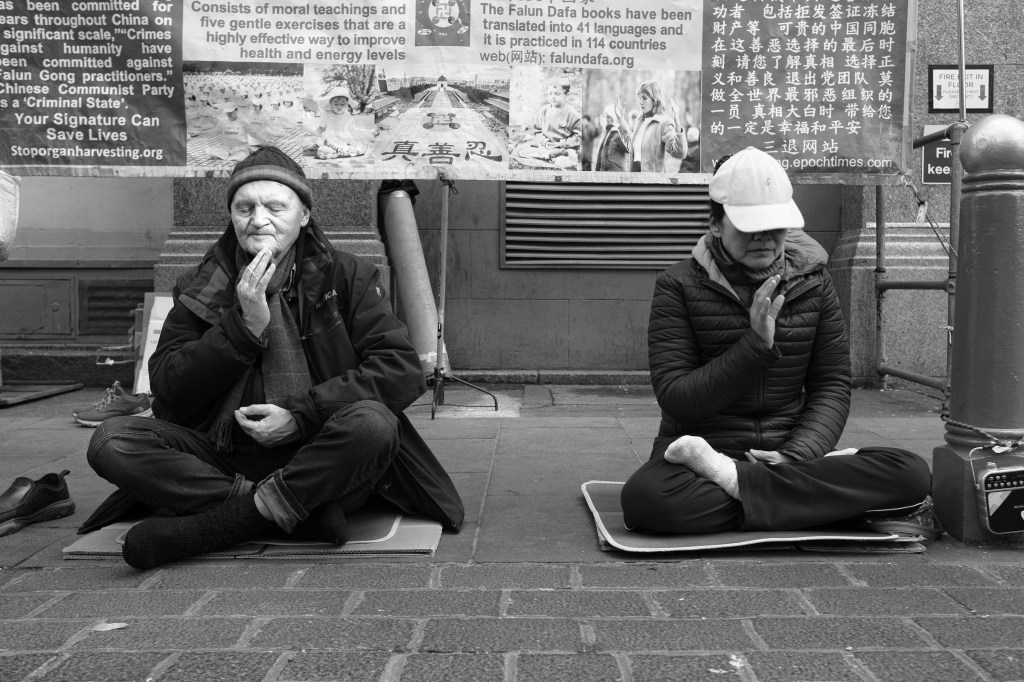 Crossed legs in Chiatown, London 2024. A photo by William Austin-Lobley.